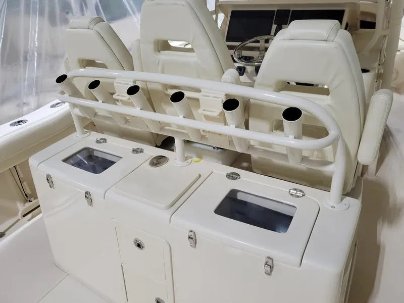 Slide: The Image of 2019 Grady-White 336 Canyon boat interior with rod holders and storage compartments. - 34