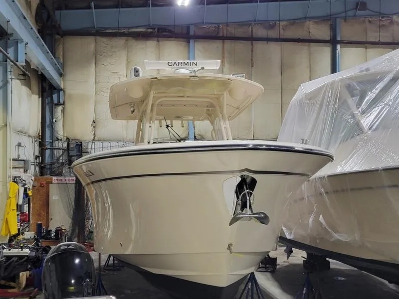Slide: The Image of 2019 Grady-White 336 Canyon boat in storage, front view, with Garmin equipment. - 41