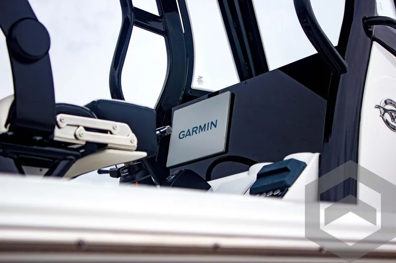 Slide: The Image of Tidewater 2410 Bay Max 2025 boat with Garmin navigation system. - 14