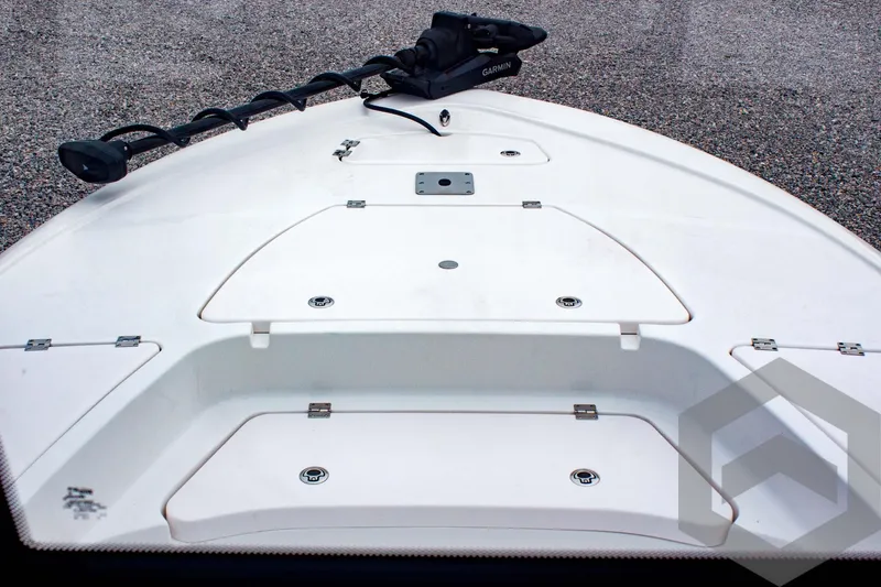 Slide: The Image of 2025 Tidewater 2410 Bay Max boat deck with storage compartments and trolling motor. - 18