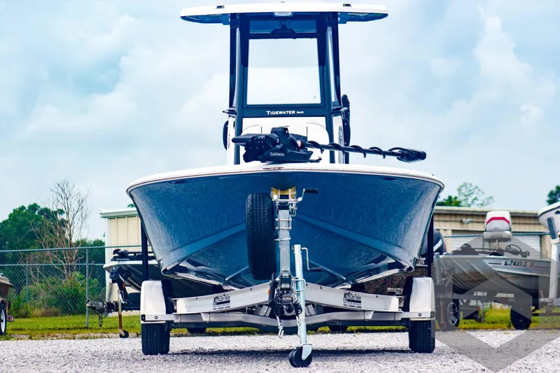 Slide: The Image of 2025 Tidewater 2410 Bay Max boat on trailer, front view, outdoors. - 2