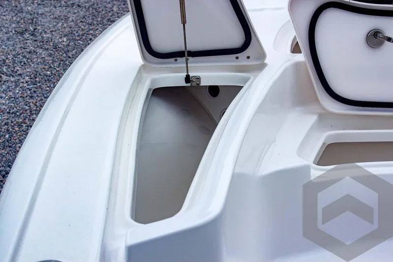 Slide: The Image of 2025 Tidewater 2410 Bay Max boat storage compartments open on deck. - 20
