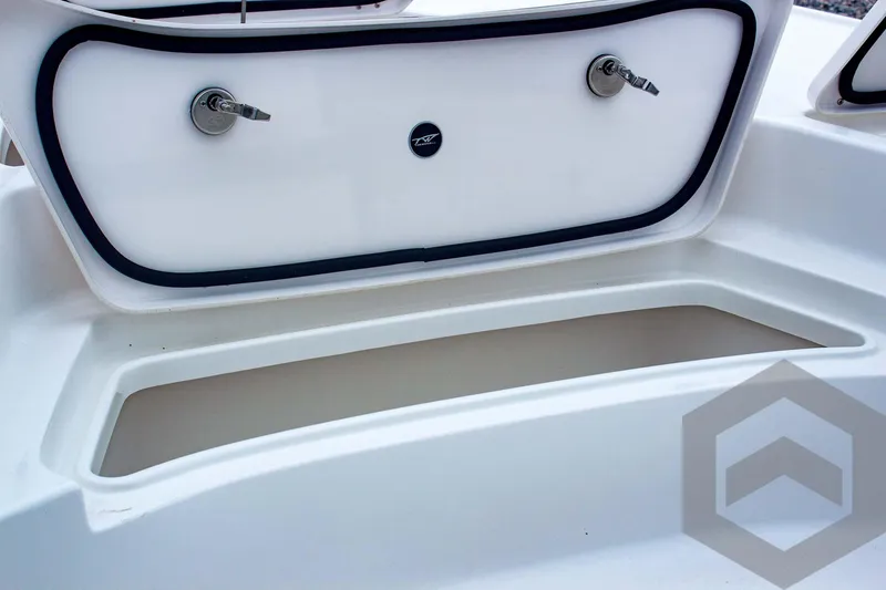 Slide: The Image of 2025 Tidewater 2410 Bay Max boat storage compartment with secure latches and sleek design. - 21