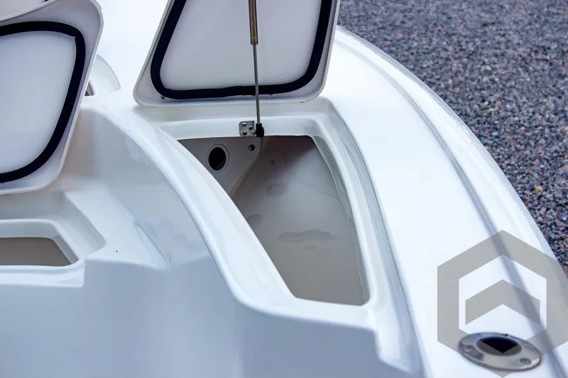 Slide: The Image of 2025 Tidewater 2410 Bay Max boat storage compartments open on deck. - 23