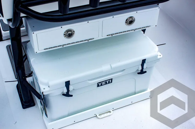 Slide: The Image of YETI cooler on 2025 Tidewater 2410 Bay Max boat, featuring storage drawers. - 32