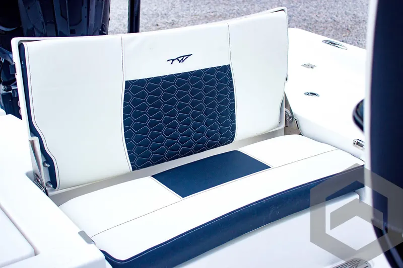 Slide: The Image of Tidewater 2410 Bay Max 2025 boat seat with blue and white upholstery design. - 37