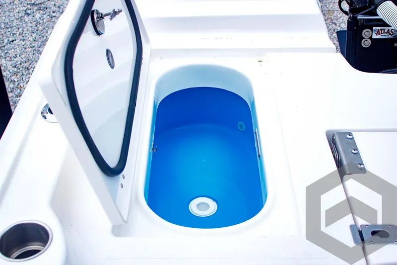 Slide: The Image of 2025 Tidewater 2410 Bay Max boat livewell with open lid, showcasing interior design. - 38