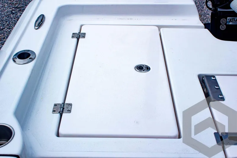 Slide: The Image of 2025 Tidewater 2410 Bay Max boat deck with storage compartment and fishing rod holder. - 39