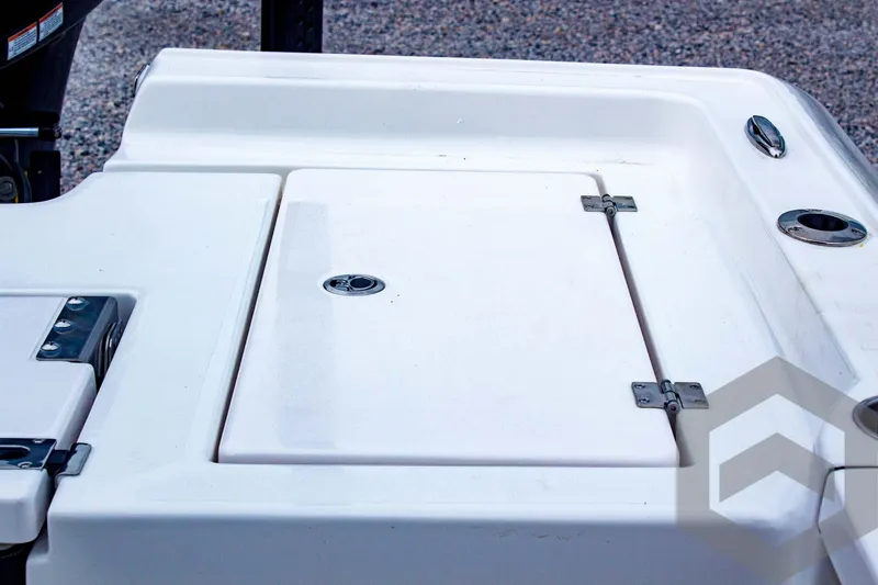 Slide: The Image of 2025 Tidewater 2410 Bay Max boat deck with storage compartment and cup holders. - 40