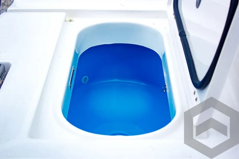 Slide: The Image of Livewell of 2025 Tidewater 2410 Bay Max boat, featuring a blue interior. - 41