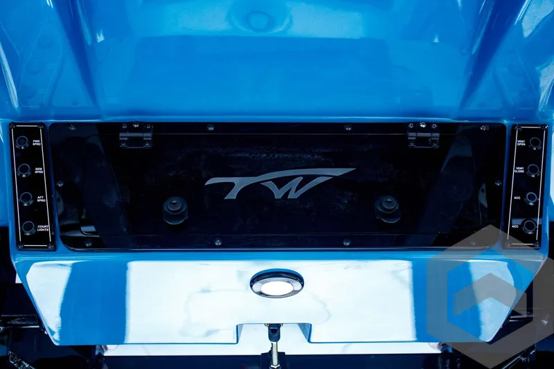 Slide: The Image of 2025 Tidewater 2410 Bay Max boat transom with blue finish and logo detail. - 43