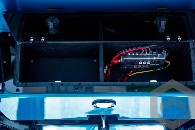 Slide: The Image of 2025 Tidewater 2410 Bay Max boat electrical compartment with wiring and fuse box. - 46