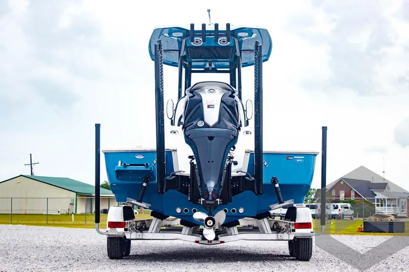 Slide: The Image of 2025 Tidewater 2410 Bay Max boat on trailer, rear view, outdoors. - 7