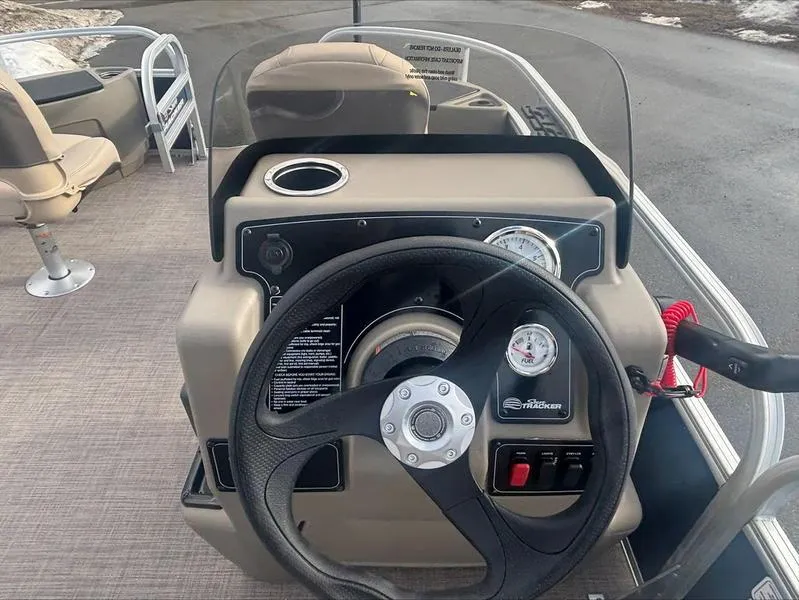 Slide: The Image of Steering console of 2025 Sun Tracker BB 18 DLX pontoon boat with gauges and controls. - 10