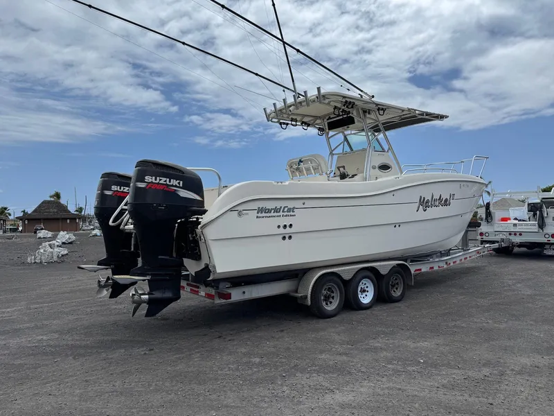 Slide: The Image of 2009 World Cat 270 TE boat on trailer with dual Suzuki outboard motors. - 11