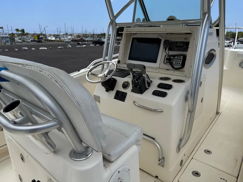 Slide: The Image of 2009 World Cat 270 TE boat cockpit with steering wheel and navigation equipment. - 17