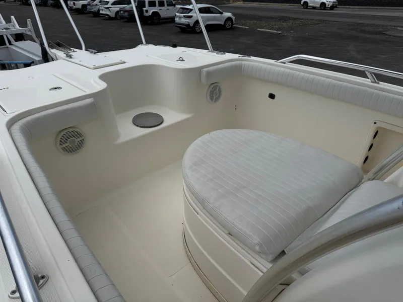 Slide: The Image of 2009 World Cat 270 TE boat interior with cushioned seating and speakers. - 18