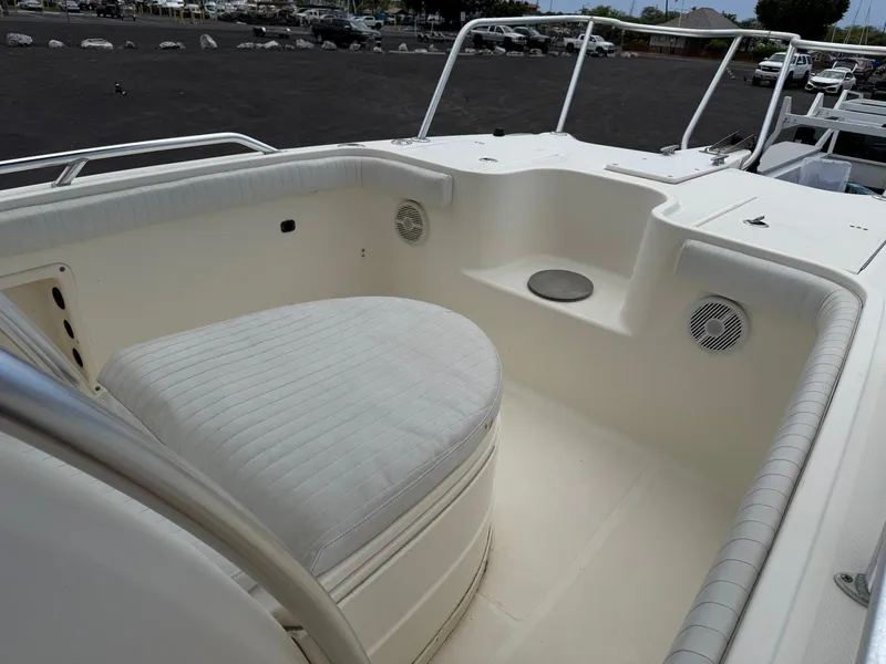 Slide: The Image of 2009 World Cat 270 TE boat interior with cushioned seating and speakers. - 19