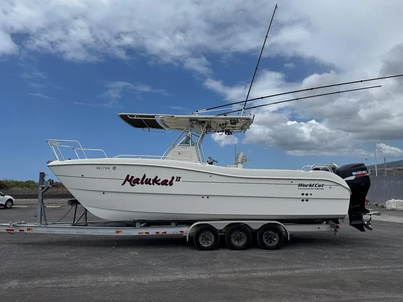 Slide: The Image of 2009 World Cat 270 TE boat on trailer under cloudy sky. - 8