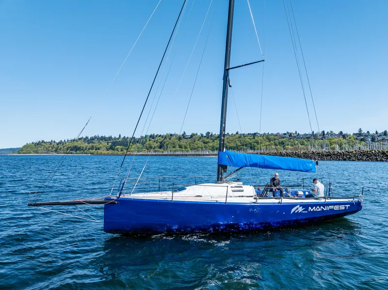 Slide: The Image of 2016 Offshore Racing Van Munster Boats Fred Barrett 35 sailing on blue water. - 1