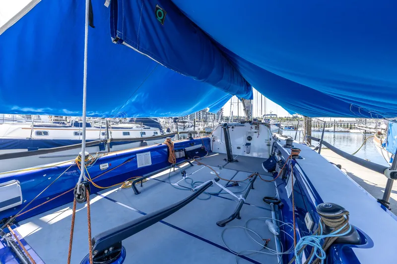 Slide: The Image of 2016 Offshore Racing Van Munster Boats Fred Barrett 35 sailboat with blue canopy in marina. - 10
