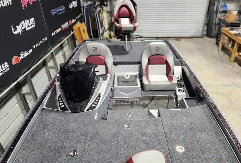 Slide: The Image of 2025 Triton 20XP Patriot boat interior with dual seats and modern dashboard. - 11