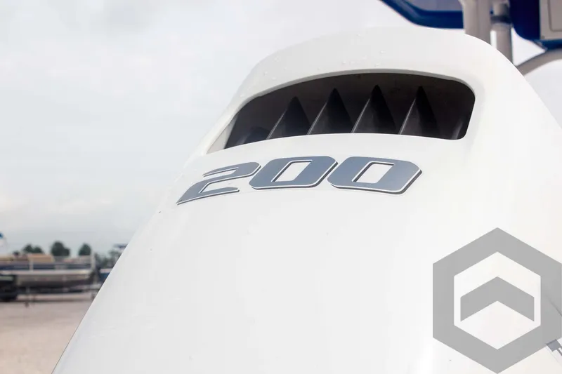 Slide: The Image of 2023 Sea Pro 208 Bay boat engine with "200" decal, close-up view. - 16