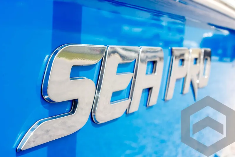 Slide: The Image of 2023 Sea Pro 208 Bay boat logo on vibrant blue background. - 18