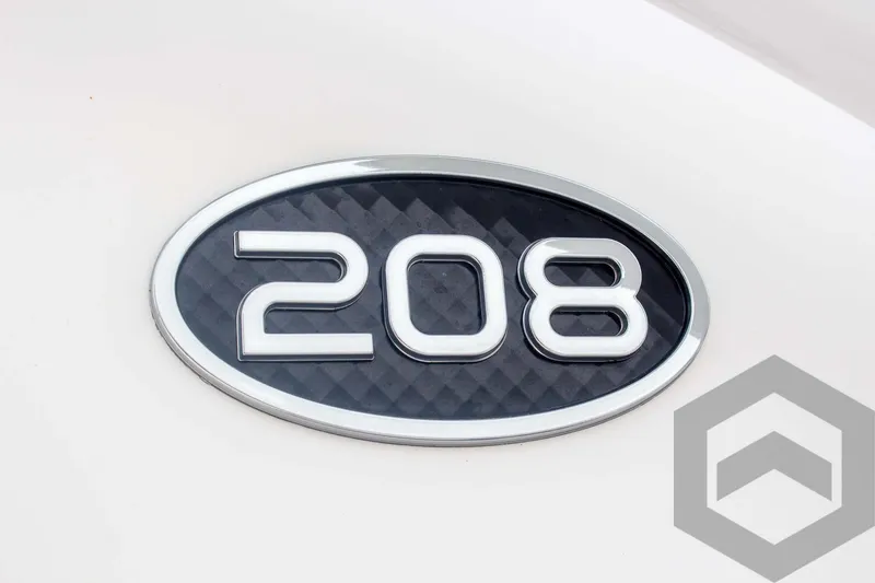 Slide: The Image of 2023 Sea Pro 208 Bay model emblem on a sleek surface. - 22