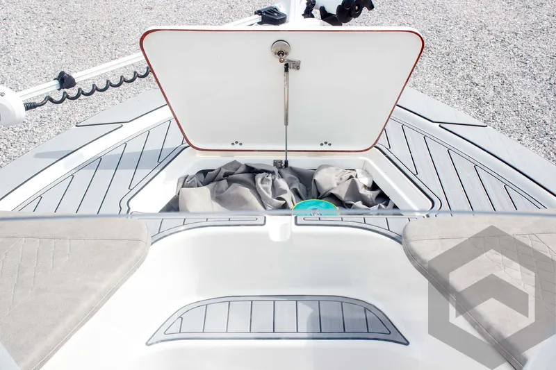 Slide: The Image of 2023 Sea Pro 208 Bay boat with open storage compartment on deck. - 24