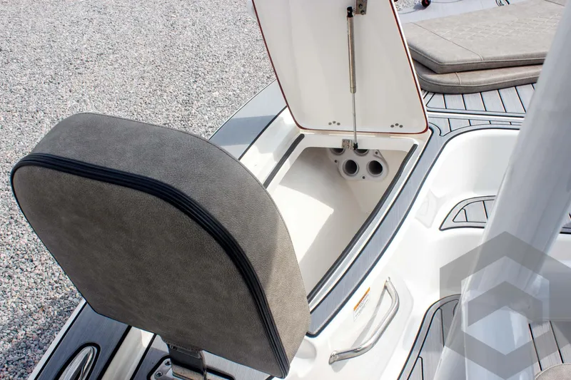 Slide: The Image of 2023 Sea Pro 208 Bay boat interior storage compartment with open lid and cushioned seat. - 28