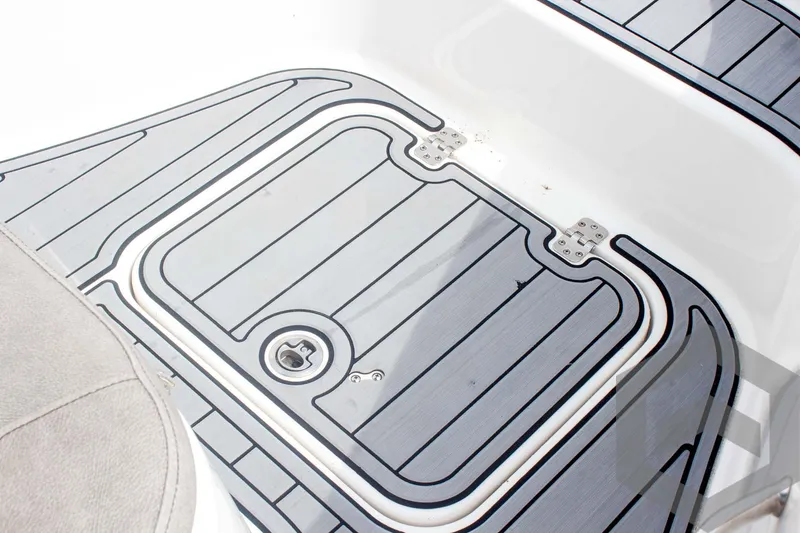 Slide: The Image of 2023 Sea Pro 208 Bay boat deck with non-slip surface and storage hatch. - 32