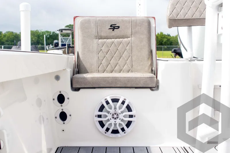 Slide: The Image of 2023 Sea Pro 208 Bay boat interior with cushioned seat and speaker system. - 37
