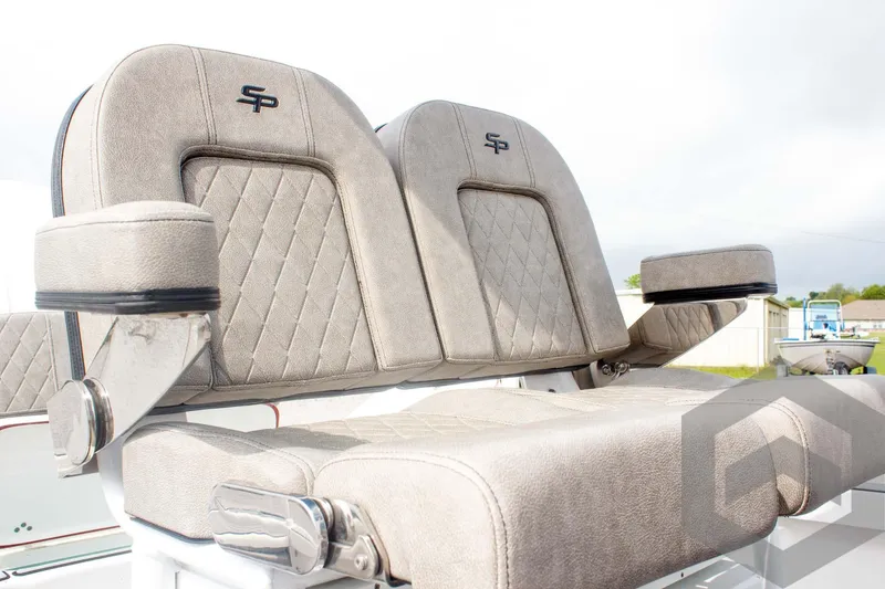 Slide: The Image of 2023 Sea Pro 208 Bay boat seats with armrests, featuring quilted upholstery and SP logo. - 39