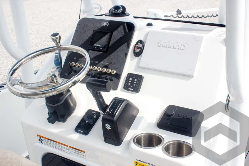 Slide: The Image of 2023 Sea Pro 208 Bay boat dashboard with steering wheel and controls. - 40