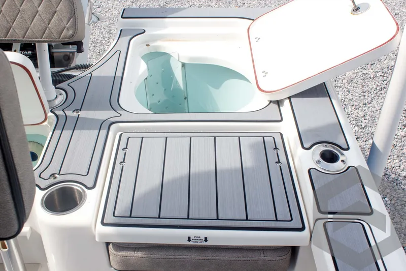 Slide: The Image of 2023 Sea Pro 208 Bay boat deck with storage compartments and seating. - 46