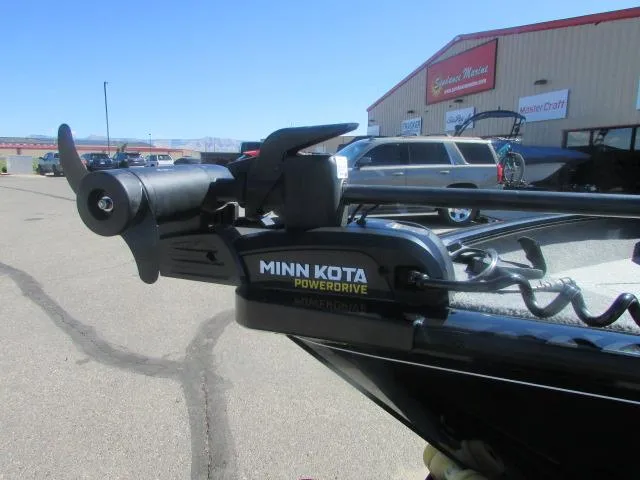 Slide: The Image of 2023 Tracker Pro Guide V16WT with Minn Kota PowerDrive motor in parking lot. - 3