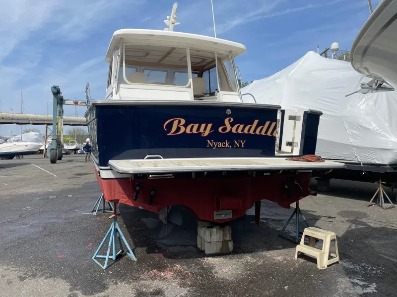 Slide: The Image of 2005 Sabre 38 Hardtop Express boat named "Bay Saddle" in a marina, Nyack, NY. - 11