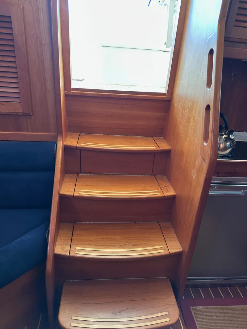 Slide: The Image of Wooden interior stairs on a 2005 Sabre 38 Hardtop Express yacht. - 27
