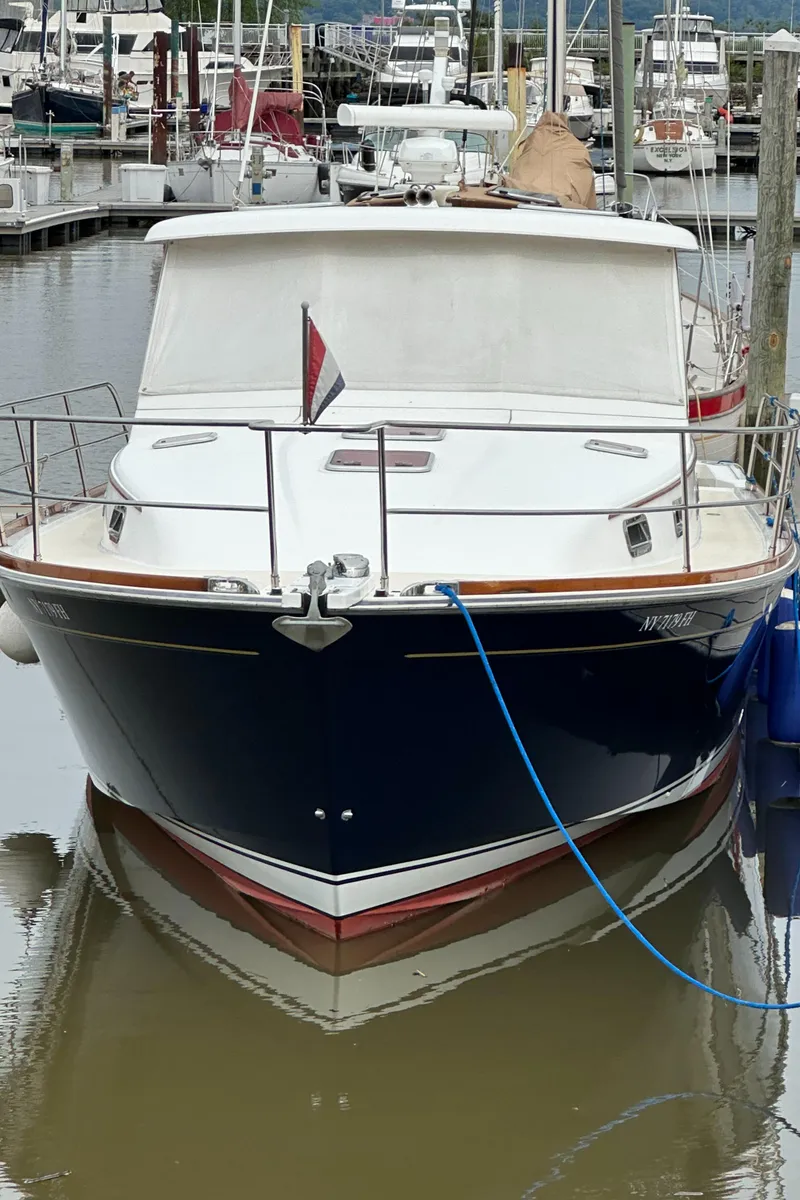 Slide: The Image of 2005 Sabre 38 Hardtop Express docked at marina, front view. - 4