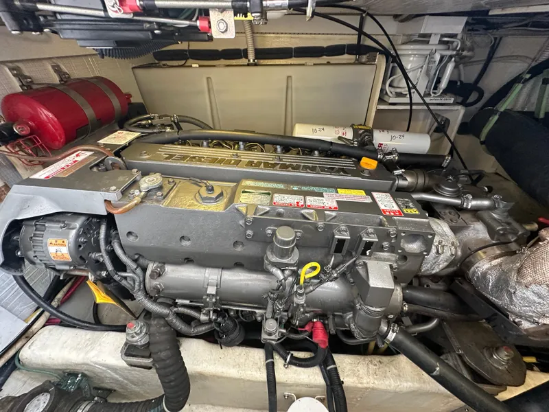 Slide: The Image of Engine compartment of a 2005 Sabre 38 Hardtop Express boat, showcasing detailed machinery. - 44