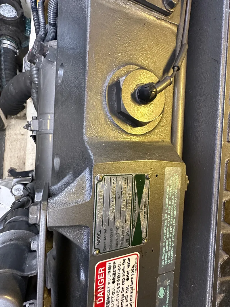 Slide: The Image of Engine compartment of a 2005 Sabre 38 Hardtop Express with warning labels. - 45