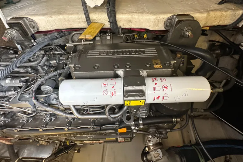 Slide: The Image of Engine of 2005 Sabre 38 Hardtop Express, showcasing detailed mechanical components. - 47