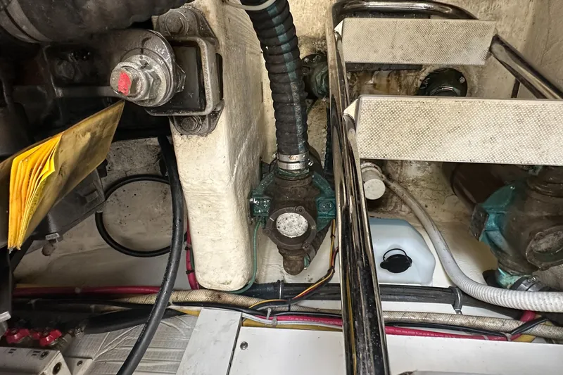 Slide: The Image of Engine compartment of a 2005 Sabre 38 Hardtop Express with visible wiring and components. - 49