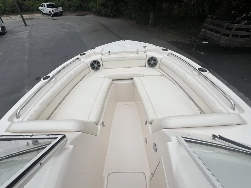 Slide: The Image of 2021 Grady-White Freedom 215 boat interior with white cushioned seating. - 10