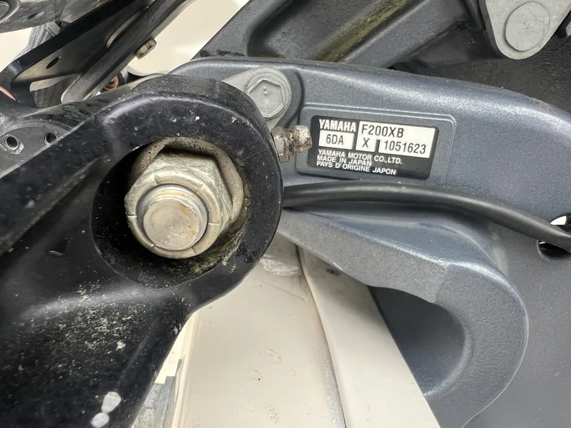 Slide: The Image of Close-up of Yamaha F200XB engine part on 2021 Grady-White Freedom 215 boat. - 19