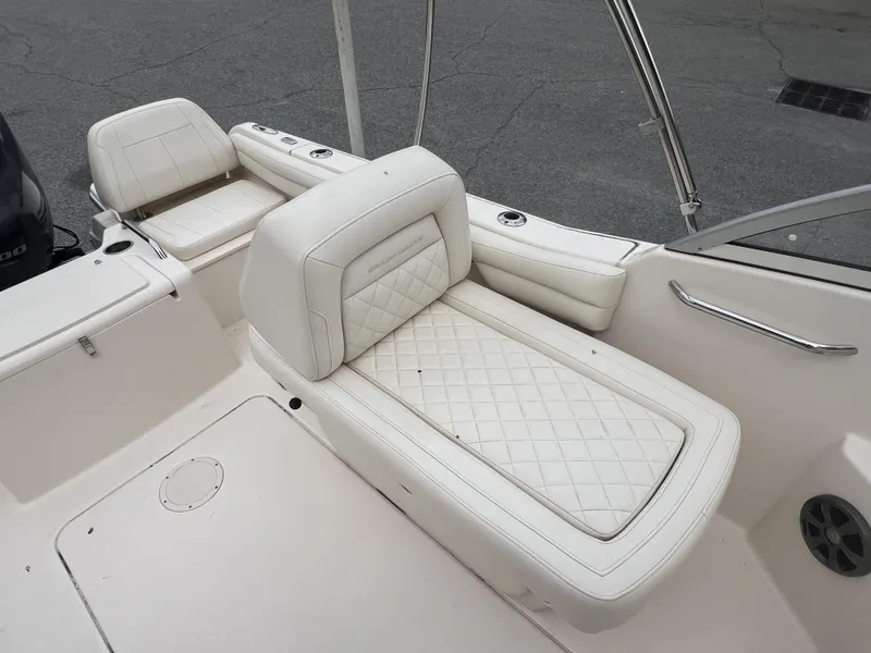Slide: The Image of 2021 Grady-White Freedom 215 boat interior with white cushioned seating. - 5