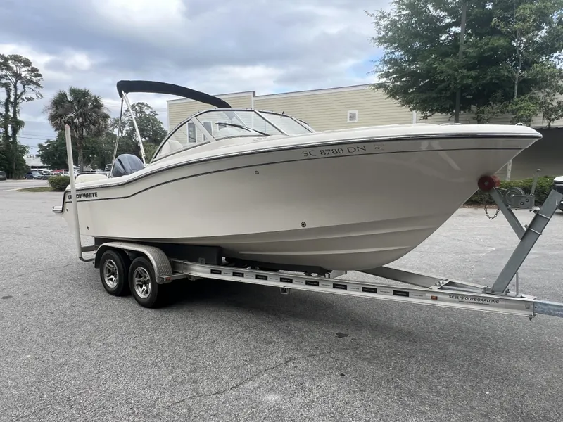 Slide: The Image of 2021 Grady-White Freedom 215 boat on trailer, parked outdoors. - 9