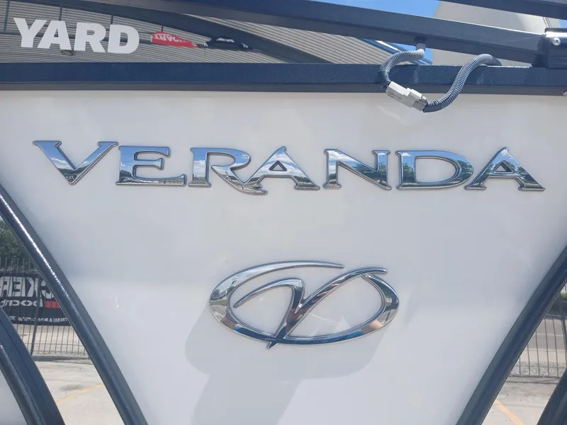 Slide: The Image of 2023 Veranda VP22VLC boat logo with chrome lettering and emblem. - 12