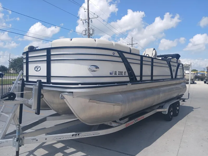 Slide: The Image of 2023 Veranda VP22VLC pontoon boat on trailer under a blue sky. - 17